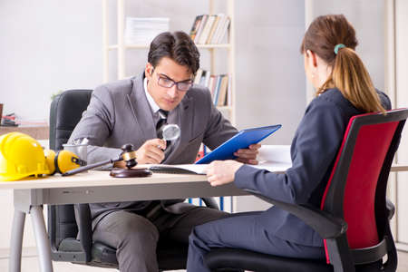 Lawyer talking to client in officeの写真素材
