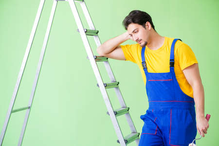 Young painter doing renovation at homeの写真素材