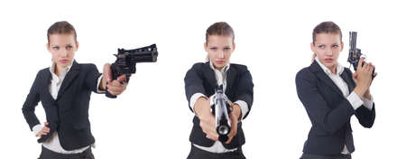 Woman businesswoman with gun on whiteの写真素材