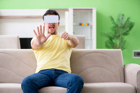 Young man with virtual reality goggles