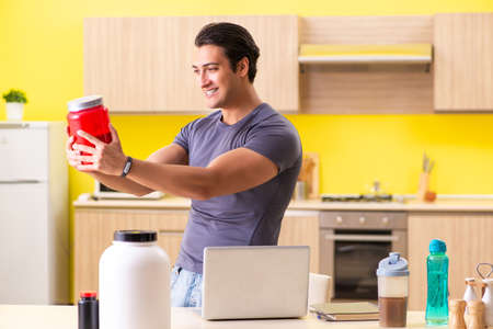 Young man blogging about food supplementsの写真素材