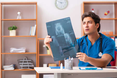Young handsome doctor radiologyst working in clinicの写真素材