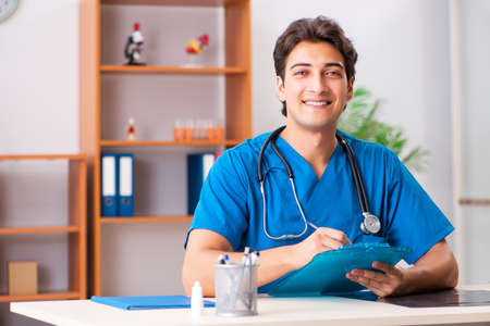 Young handsome doctor radiologyst working in clinicの写真素材