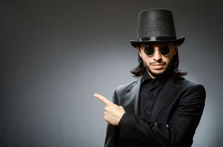 Vintage concept with man wearing black top hat