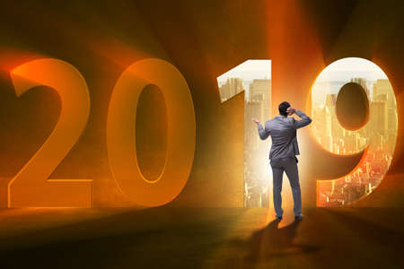 Businessman in the concept of transition to year 2019