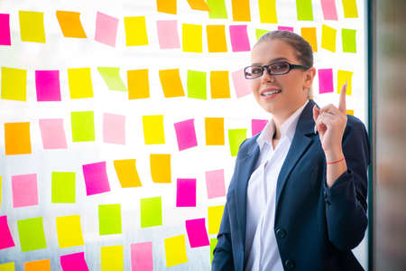 Beautiful female employee with many conflicting prioritiesの写真素材