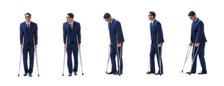 Businessman walking with crutches isolated on white backgroundの写真素材