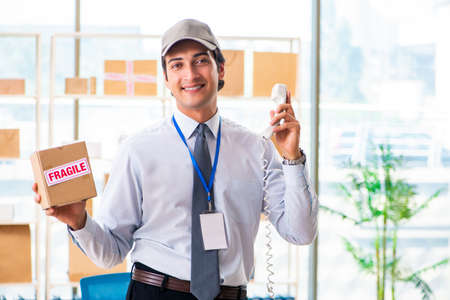 Male employee working in box delivery relocation service