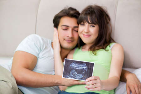Young family finding out about pregnancyの写真素材