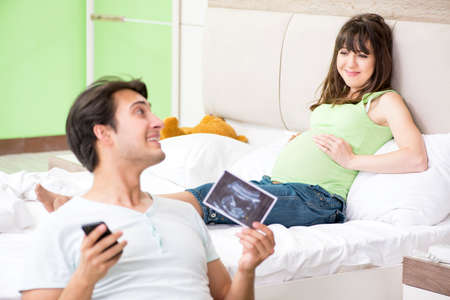 Young family finding out about pregnancyの写真素材