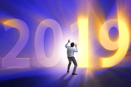Businessman in the concept of transition to year 2019