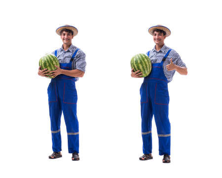 Young farmer with watermelon isolated on whiteの写真素材