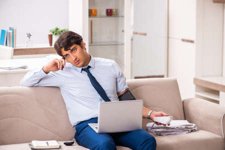Man under stress measuring his blood pressureの写真素材