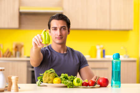 Young man in dieting and healthy eating conceptの写真素材