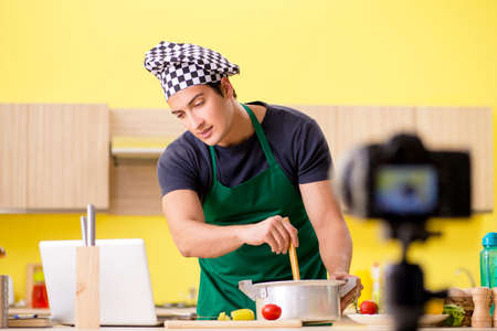 Young chef  explaining food preparationの写真素材