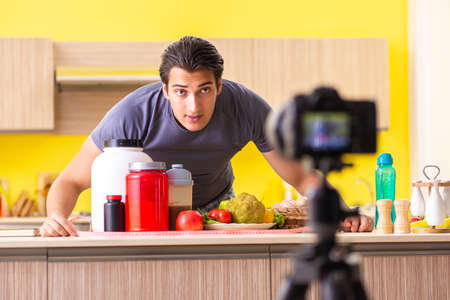 Young man blogging about food supplementsの写真素材