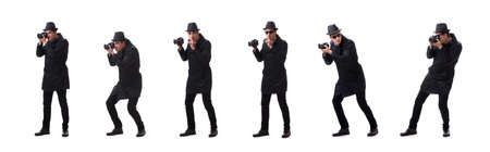 Spy with camera taking pictures isolated on whiteの写真素材