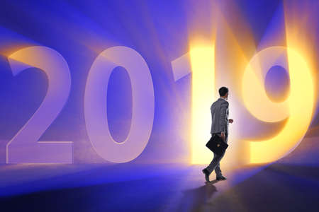 Businessman in the concept of transition to year 2019の写真素材
