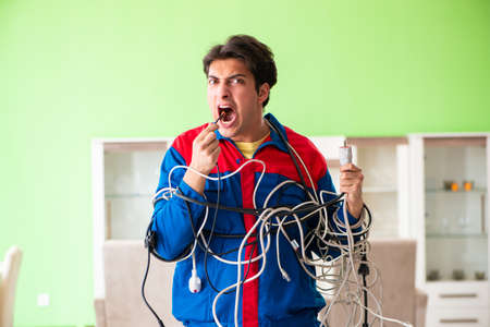 Electrician contractor with tangled cablesの写真素材