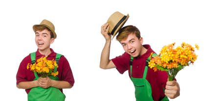 Young gardener with flower isolated on whiteの写真素材