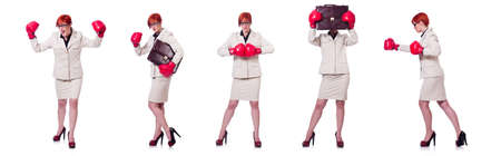 Woman businesswoman with boxing gloves on whiteの写真素材
