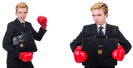Young employee with boxing gloves isolated on whiteの写真素材