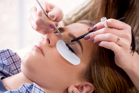 Young woman getting eyelash extensionの写真素材