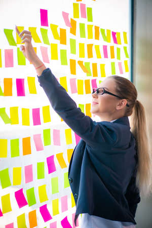 Beautiful female employee with many conflicting prioritiesの写真素材