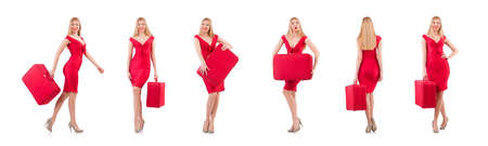 Blondie in red dress with suitcase isolated on whiteの写真素材