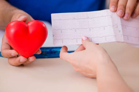 Young patient visiting doctor cardiologistの写真素材