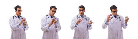 Yong male doctor with skeleton isolated on whiteの写真素材