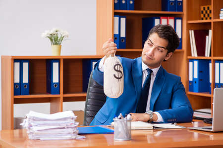 Young employee working in the officeの写真素材