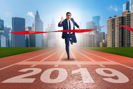 Businessman on finishing line in race for 2019の写真素材