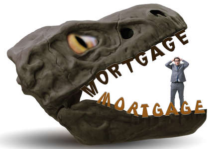 Businessman in the jaws of debt and loanの写真素材