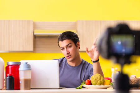 Young man blogging about food supplementsの写真素材