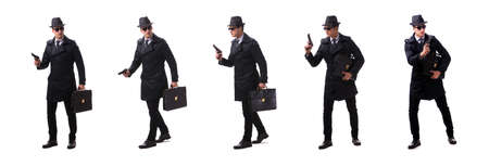 Man spy with handgun isolated on white backgroundの写真素材