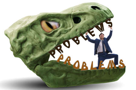 Businessman in the jaws of problemsの写真素材