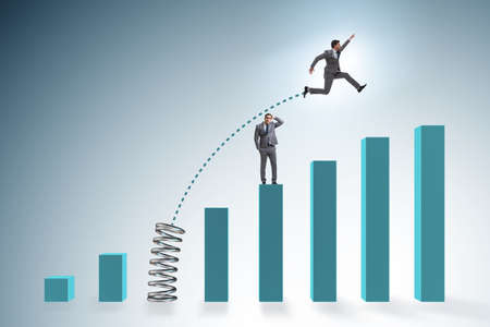 Businessman outperforming his competition jumping overの写真素材