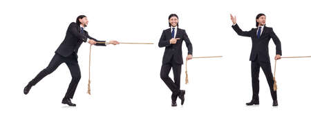 Young businessman pulling rope isolated on whiteの写真素材