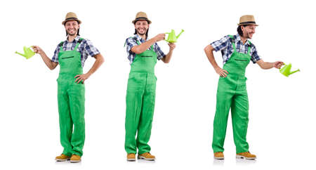 Young cheerful gardener with watering can isolated on whiteの写真素材