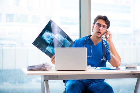 Young handsome doctor working in the hospitalの写真素材