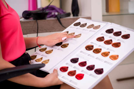 Customer choosing colour for her hair