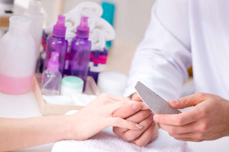 Hands during manicure care sessionの写真素材