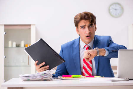 Young attractive businessman working in the officeの写真素材