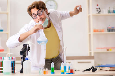 Funny crazy chemist doing experiments and tests