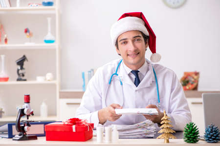 Doctor with gift box in the hospitalの写真素材