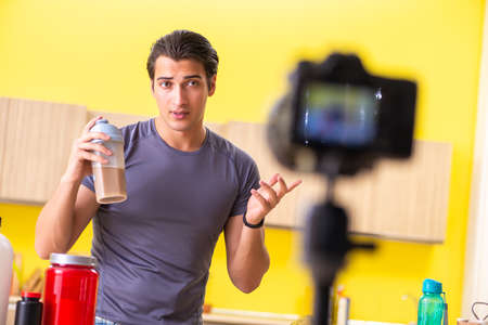 Young man blogging about food supplements