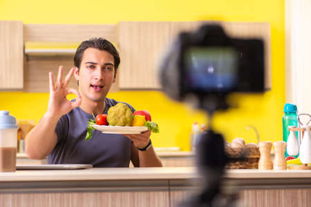 Young man blogging about food supplementsの写真素材