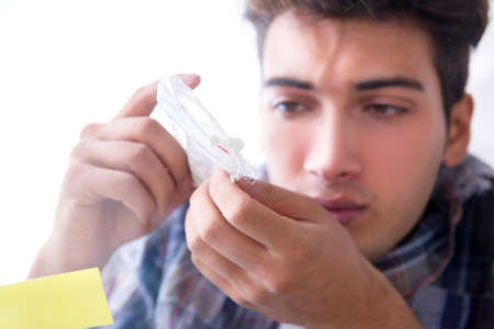 Drug addict sniffing cocaine narcoticの写真素材