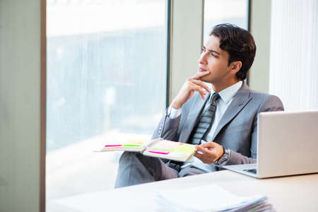 Young successful businessman working at the officeの写真素材